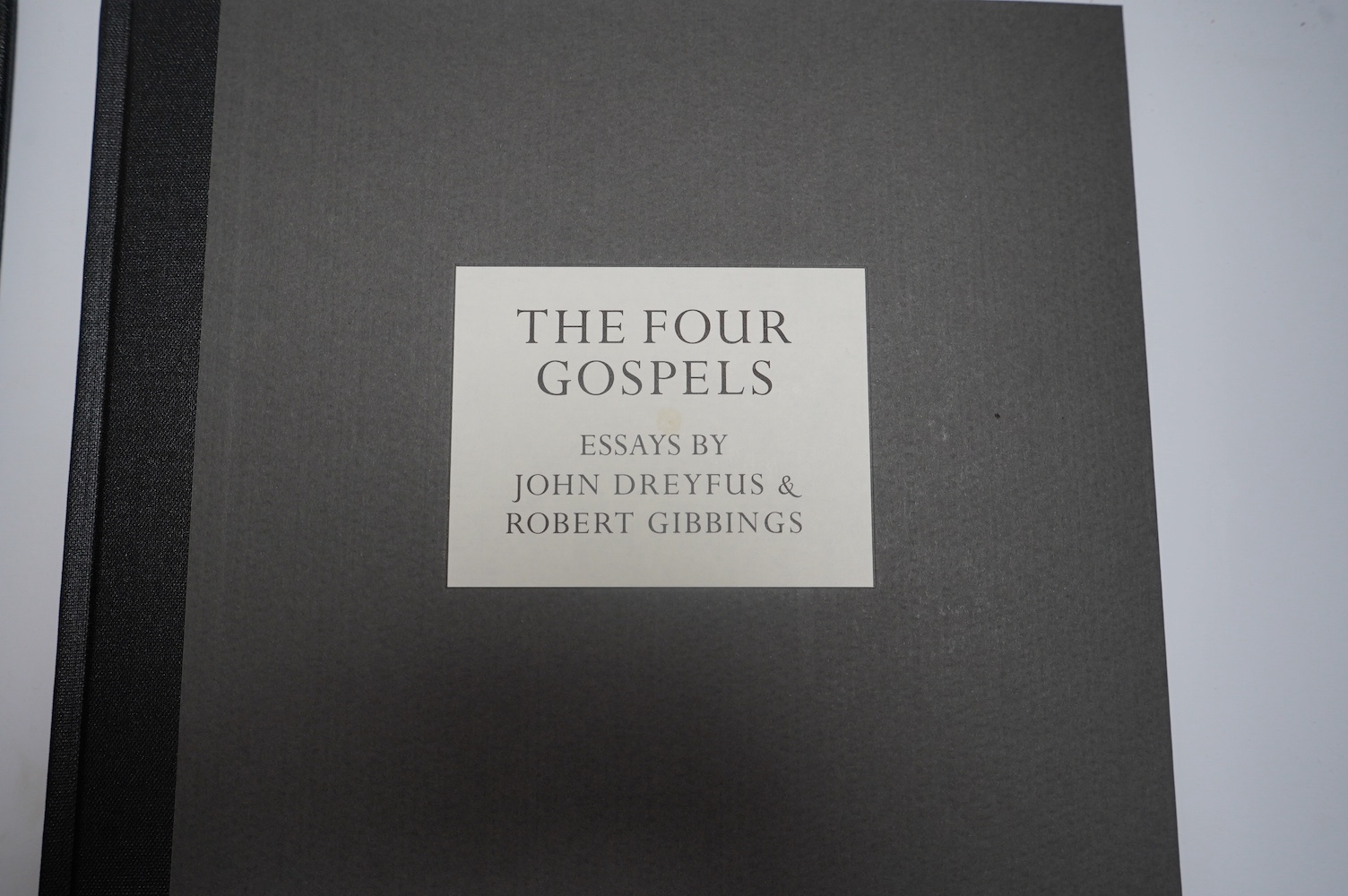 Folio Society - Gill, Eric - The Four Gospels, one of 2750, monochrome illustrations, all edges gilt, original gilt decorated full black morocco in black cloth drop box, includes Essays, by John Dreyfus & Robert Gibbings